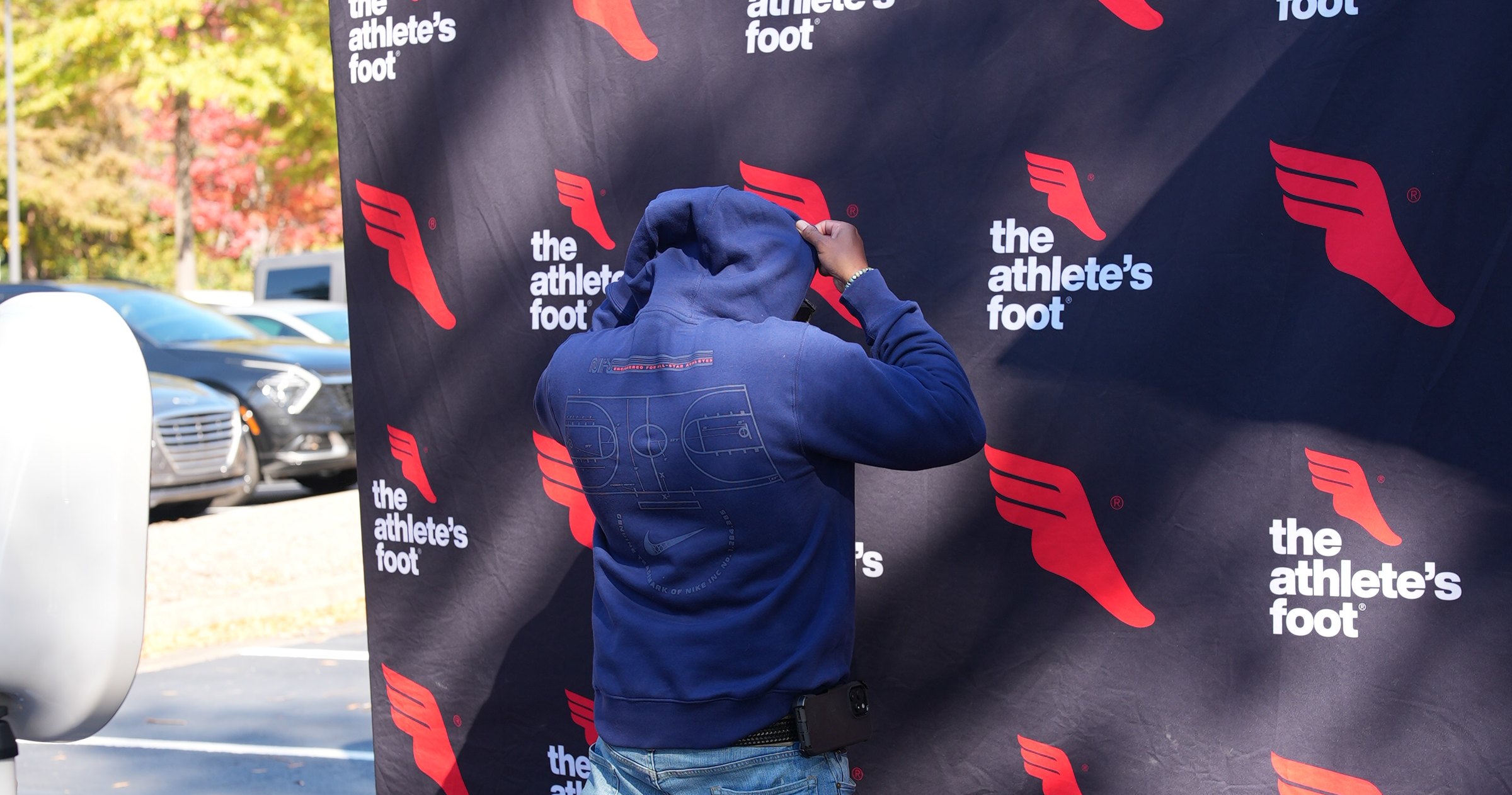 A branded backdrop set up for an event outside the store